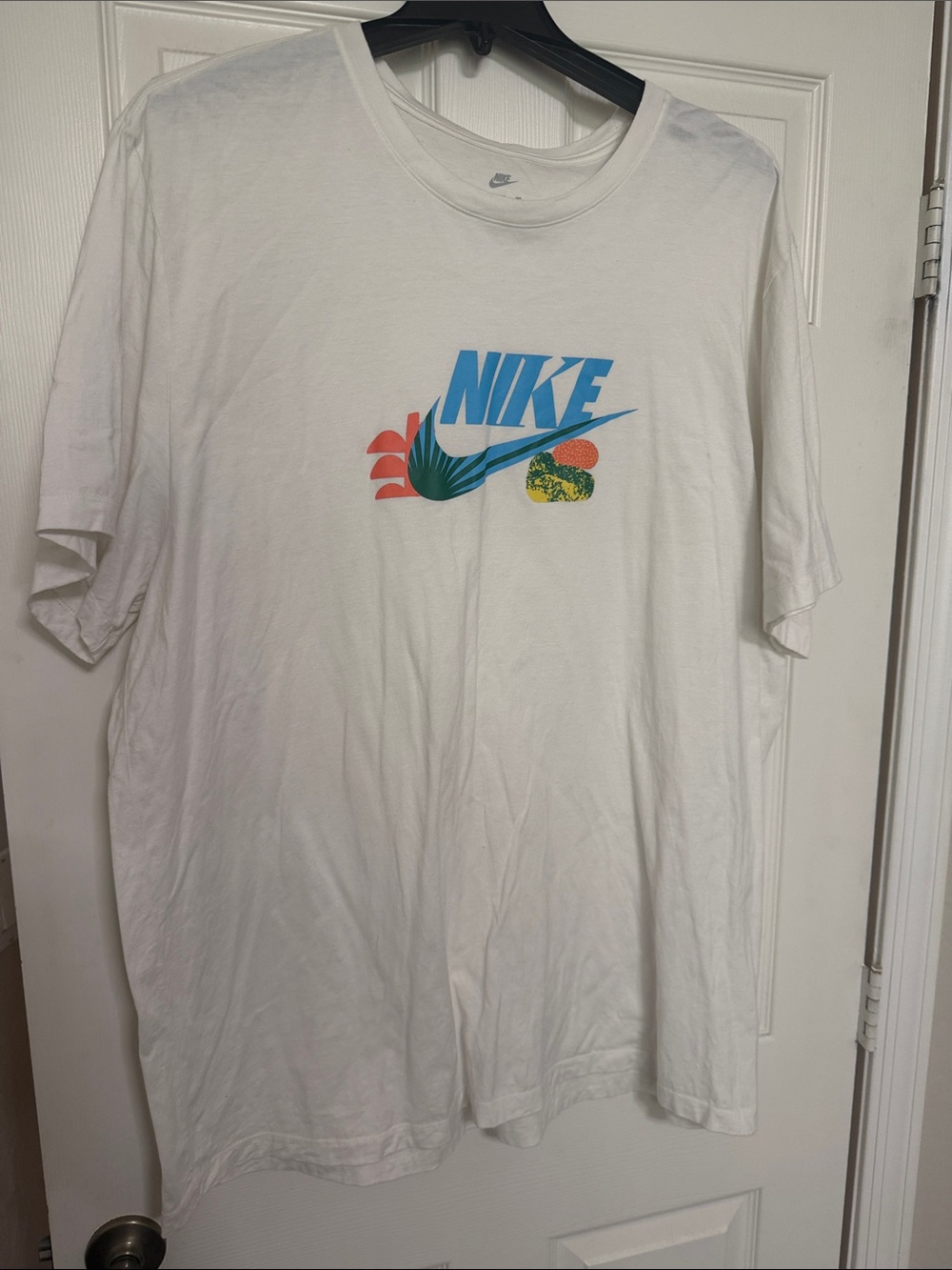 Nike White Short Sleeve Tee with Blue Logo and Multicolor Graphic